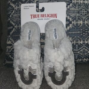 True Religion Women's Silver and Gray Fuzzy Slippers. Item J821-25. Size Medium.